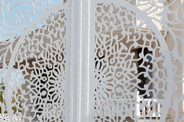White wrought iron gate of modern villa