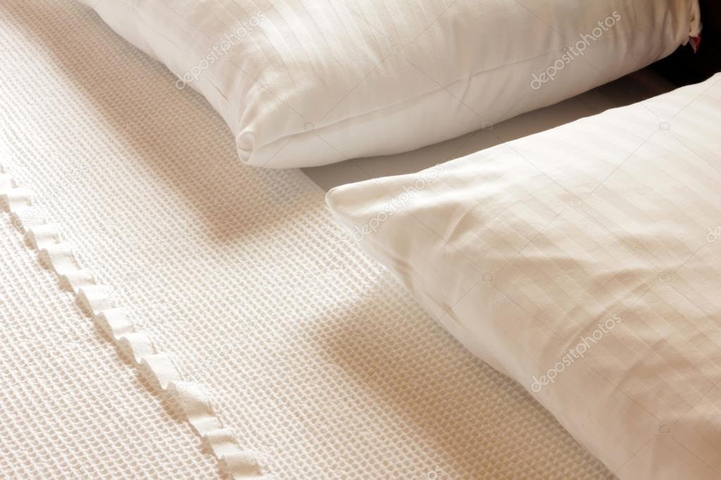clean bed linen and bedroom