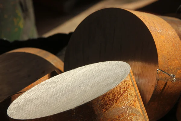 The metal cylinders are produced in the factory — Stock Photo, Image