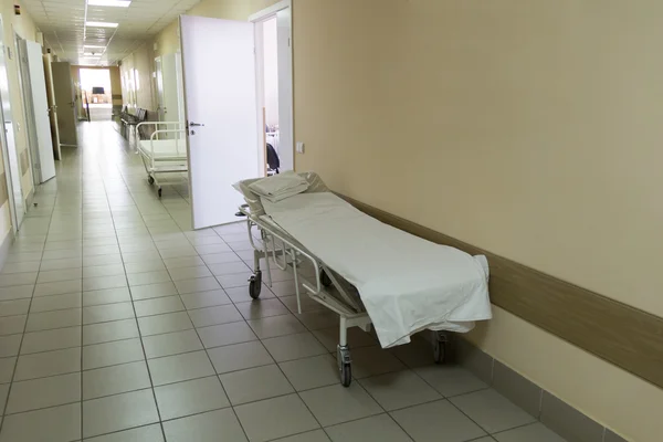 Empty stretcher in hospital corridor — Stock Photo, Image