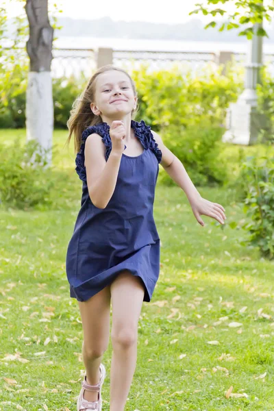 Caucasian girl run in summer with disheveled hair — Stock Photo, Image