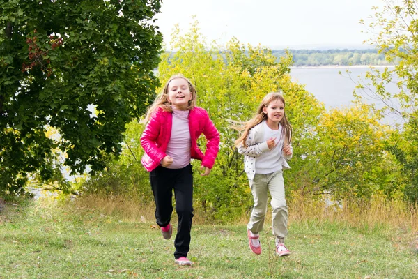 Cute two running girls — Stock Photo, Image