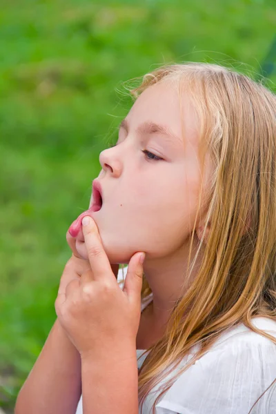 Girl makes faces imitate witch — Stock Photo, Image