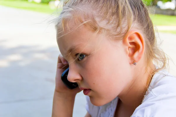 Cute girl talking by cellular — Stock Photo, Image