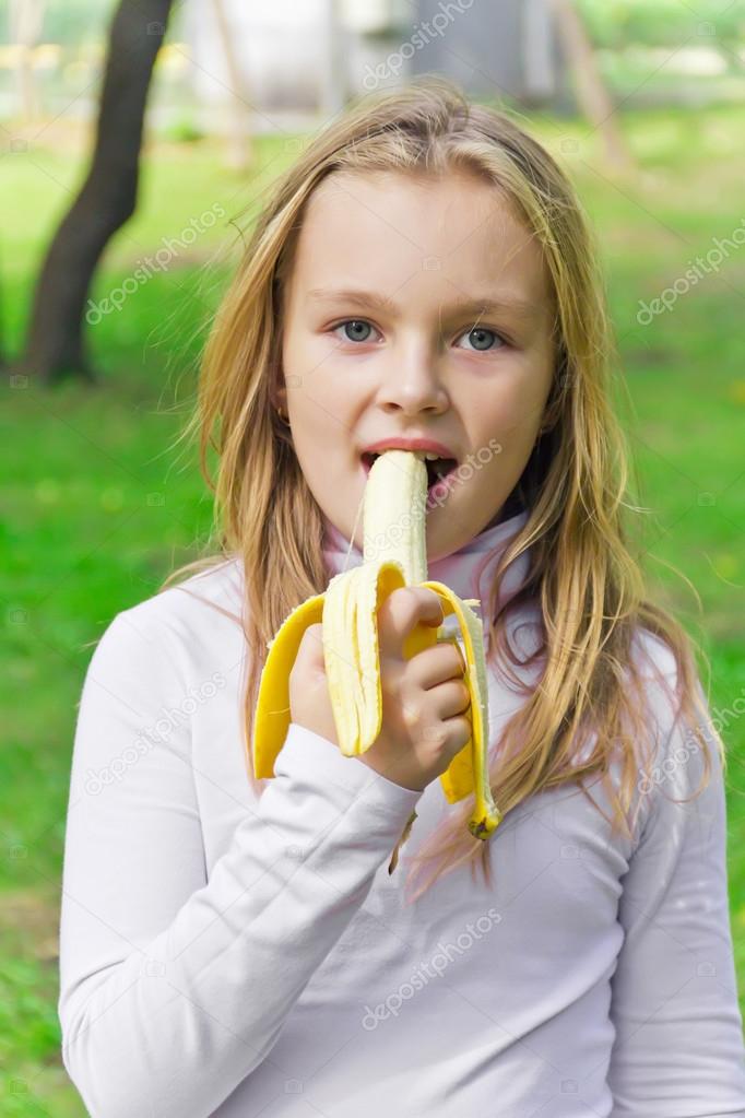 Girl are eating banana — Stock Photo © julialine #68168963