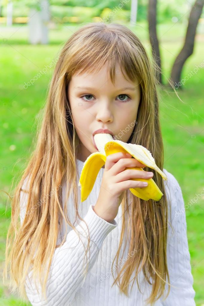 girl eating banana 
