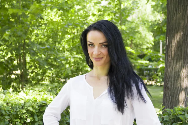 Brunette on green background — Stock Photo, Image