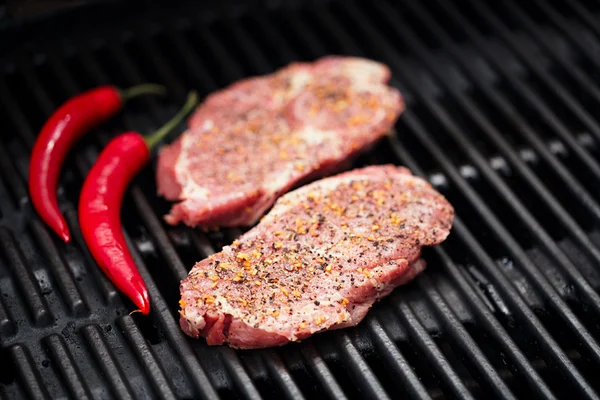 Pork steak on bbq grill no flame — Stock Photo, Image