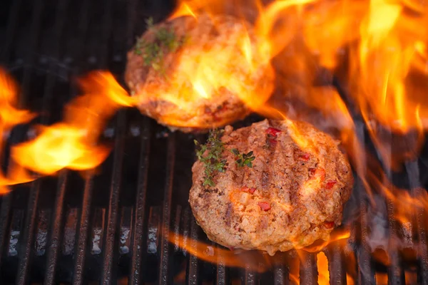 Burgers on barbecue grill — Stock Photo, Image