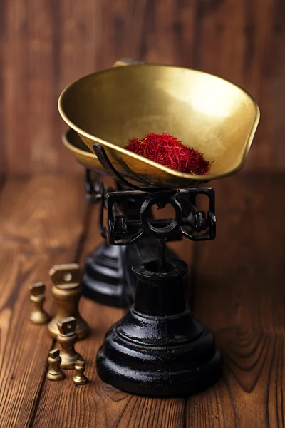 Saffron spice in  iron scale bowl — Stock Photo, Image