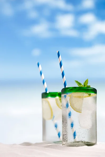 Mojito cocktail with ice, rum, lemon and mint in a glass — Stock Photo, Image