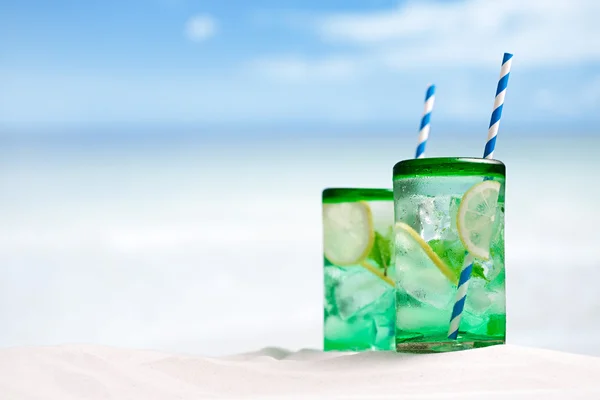 Mojito cocktail with ice, rum, lemon and mint in a glass — Stock Photo, Image