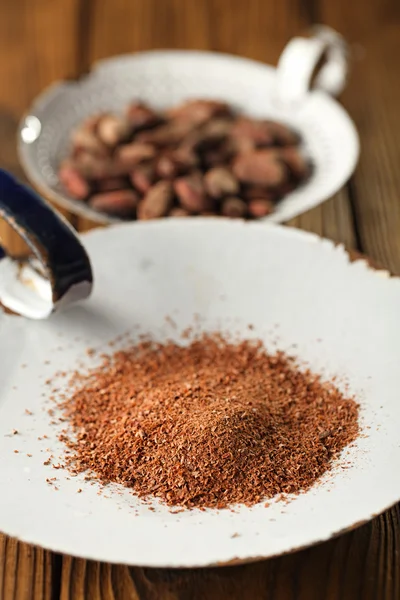 Cocoa powder and roasted cocoa chocolate beans — Stock Photo, Image
