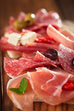antipasti Platter of Cured Meat,   jamon, olives, sausage, salam clipart