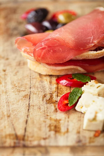 Cured Meat jamon sausage and ciabatta bread — Stock Photo, Image