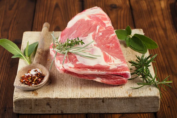 Raw shoulder lamb on board — Stock Photo, Image