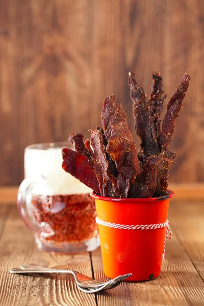 Jerky beef in orange dish — Stock Photo, Image