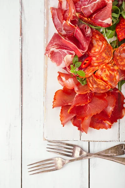 Antipasti Platter of Cured Meat and vintage forks — Stock Photo, Image