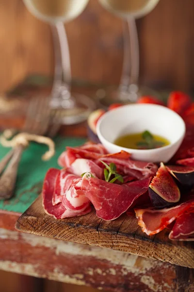 Cured Meat and vintage forks — Stock Photo, Image