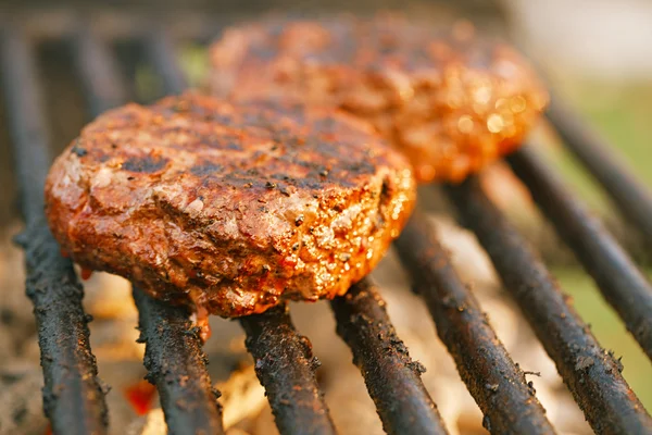 Burgers on bbq barbecue grill — Stock Photo, Image