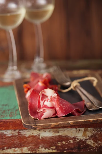 Cured Meat and vintage forks — Stock Photo, Image