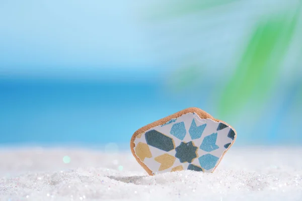 Sea glass seaglass on glitter sand — Stock Photo, Image