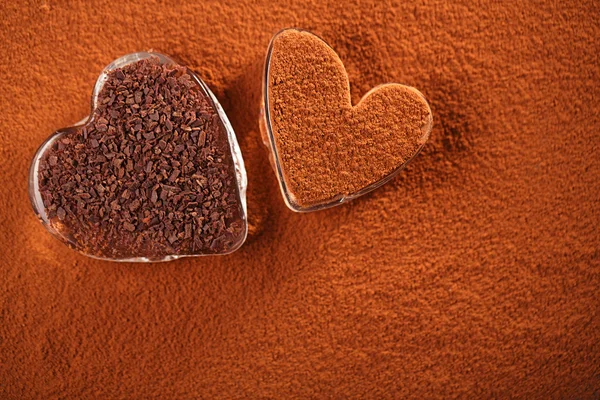 Cocoa powder and grated dark chocolate — Stock Photo, Image