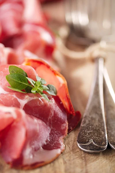 Cured Meat and vintage forks — Stock Photo, Image