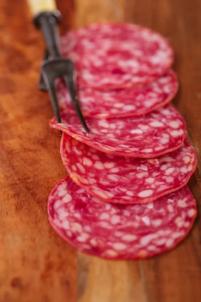 Sausage  jamon and vintage fork — Stock Photo, Image