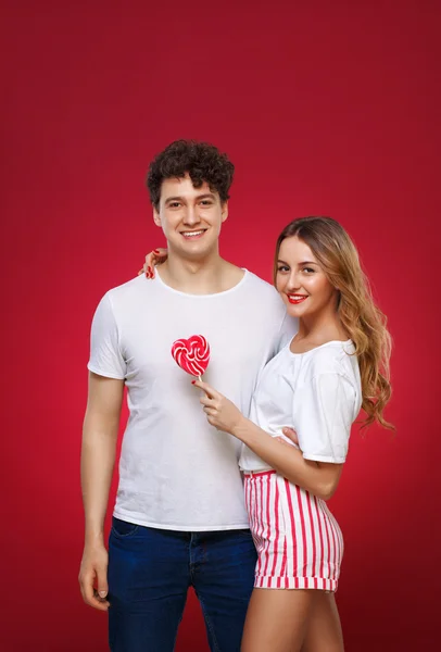 Portrait of a Man and Woman in the style of pin-up with candy in — Stock Photo, Image