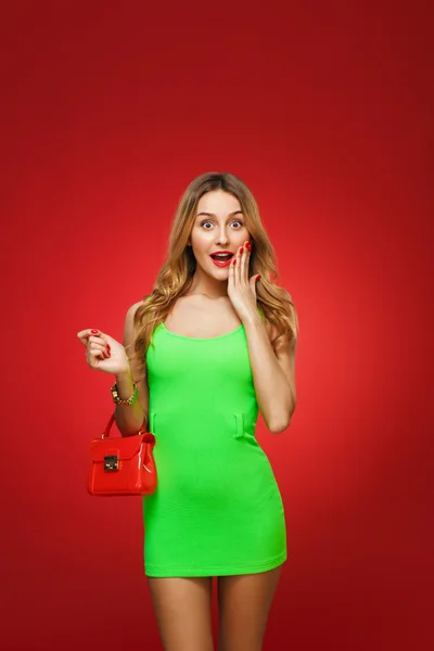 Smiling girl in a green dress in the style of pin-up, isolated o — Stock Photo, Image