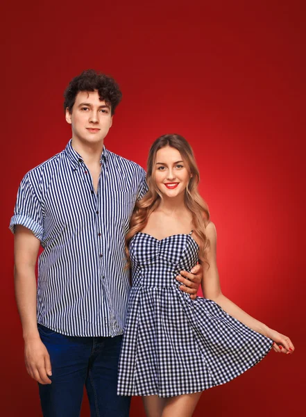 Portrait of guy and girl in pin up style, isolated on a red back — Stock Photo, Image