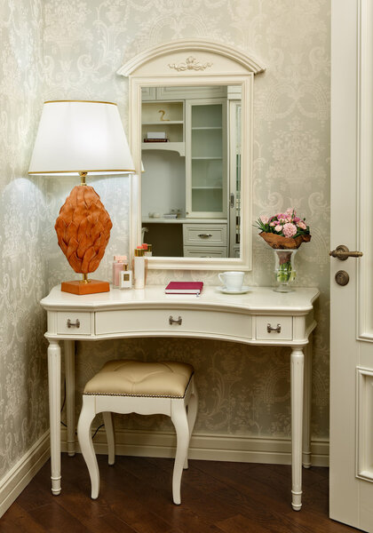 Interior room with dressing table, stool and table lamp