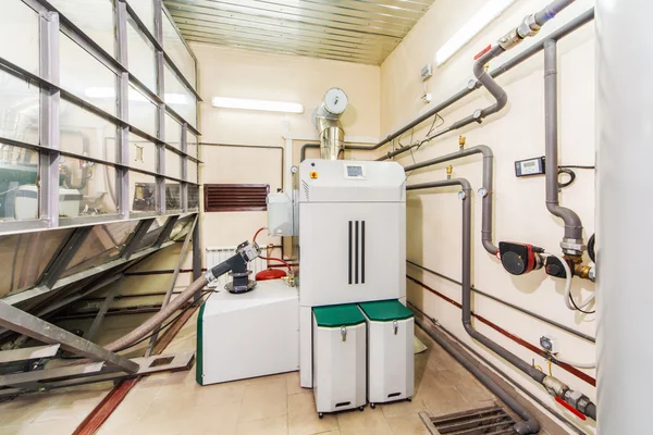 Interior boiler with a boiler on fuel from wood auger — Stock Photo, Image