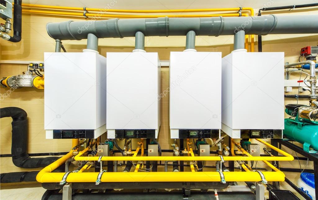 a row of four powerful domestic gas boilers