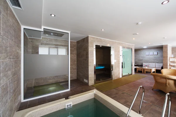 Interior of sauna with a swimming pool and a place to relax — Stock Photo, Image