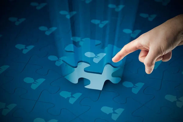 Assemble a team concept with puzzle. Business team, human resources cooperation, connection and unity concepts. Good team fit together like a puzzle pieces.