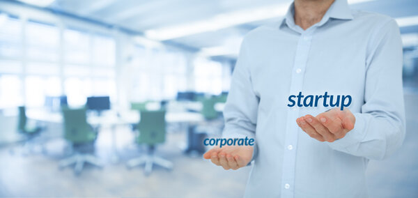 Startup versus corporate business concept