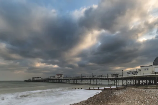 Beautiful long exposure sunset landscape image of pier at sea in — Stock Photo, Image