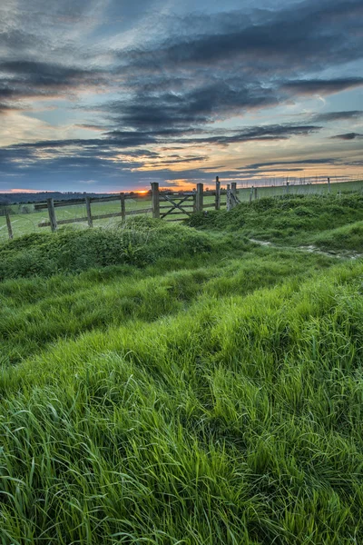 Beautiful English countryside landscape over fields at sunset — Stock Photo, Image