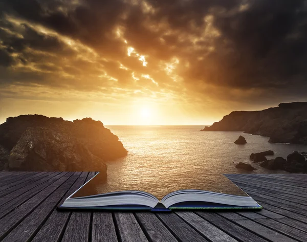 Beautiful sunset landscape over rocky cove looking out to sea — Stock Photo, Image