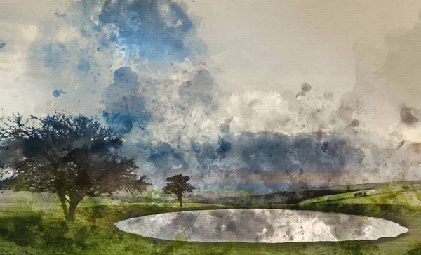 Watercolor painting of Dramatic sky over countryside landscape with naturally formed dew pond in foreground