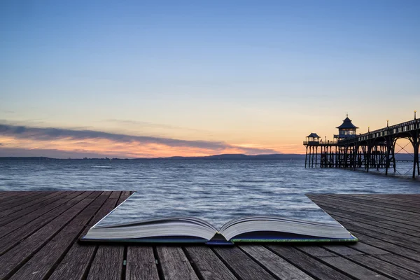 Beautiful long exposure sunset over ocean with pier silhouette c — Stock Photo, Image