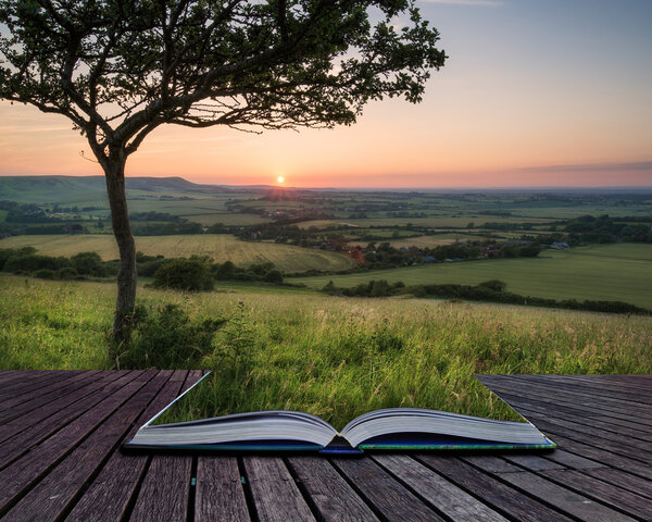 Summer sunset landscape overlooking English countryside conceptual book image