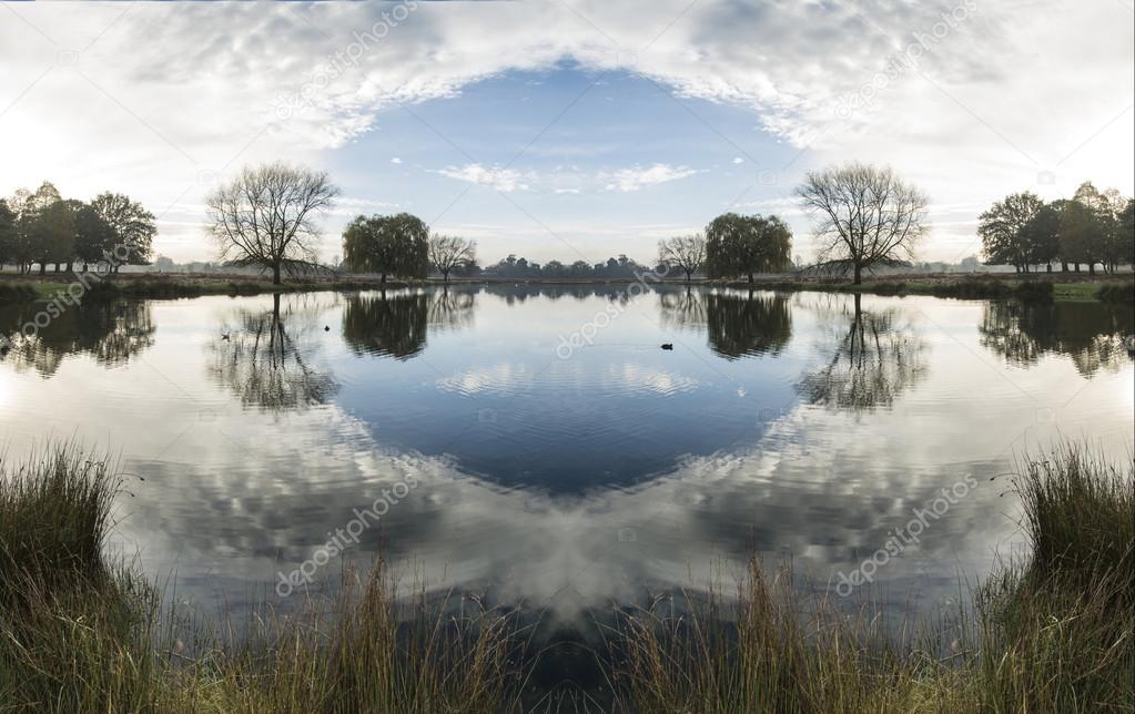 Beautiful surreal countryside lake landscape reflections