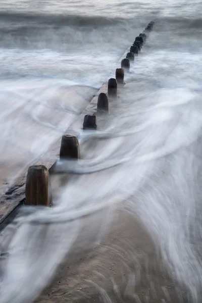 Beautiful long exposure vibrant concept image of ocean at sunset — Stock Photo, Image