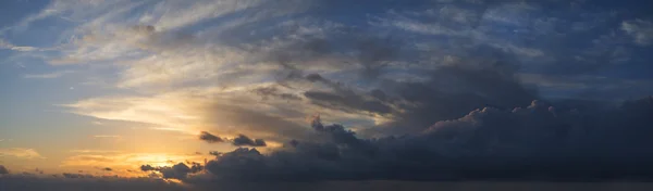 Large vibrant panorama image of stormy sunset sky — Stock Photo, Image