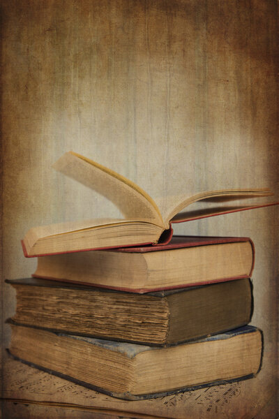 Vintage image of books with texture effect filter applied