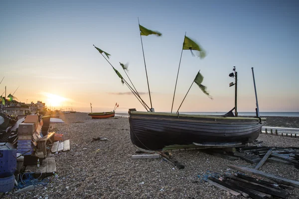 Landscape image of small fishing boats on beach at sunrise in Sp — Stock Photo, Image