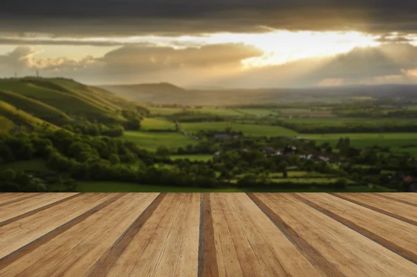 Stunning countryside landscape with sun lighting side of hills a — Stock Photo, Image